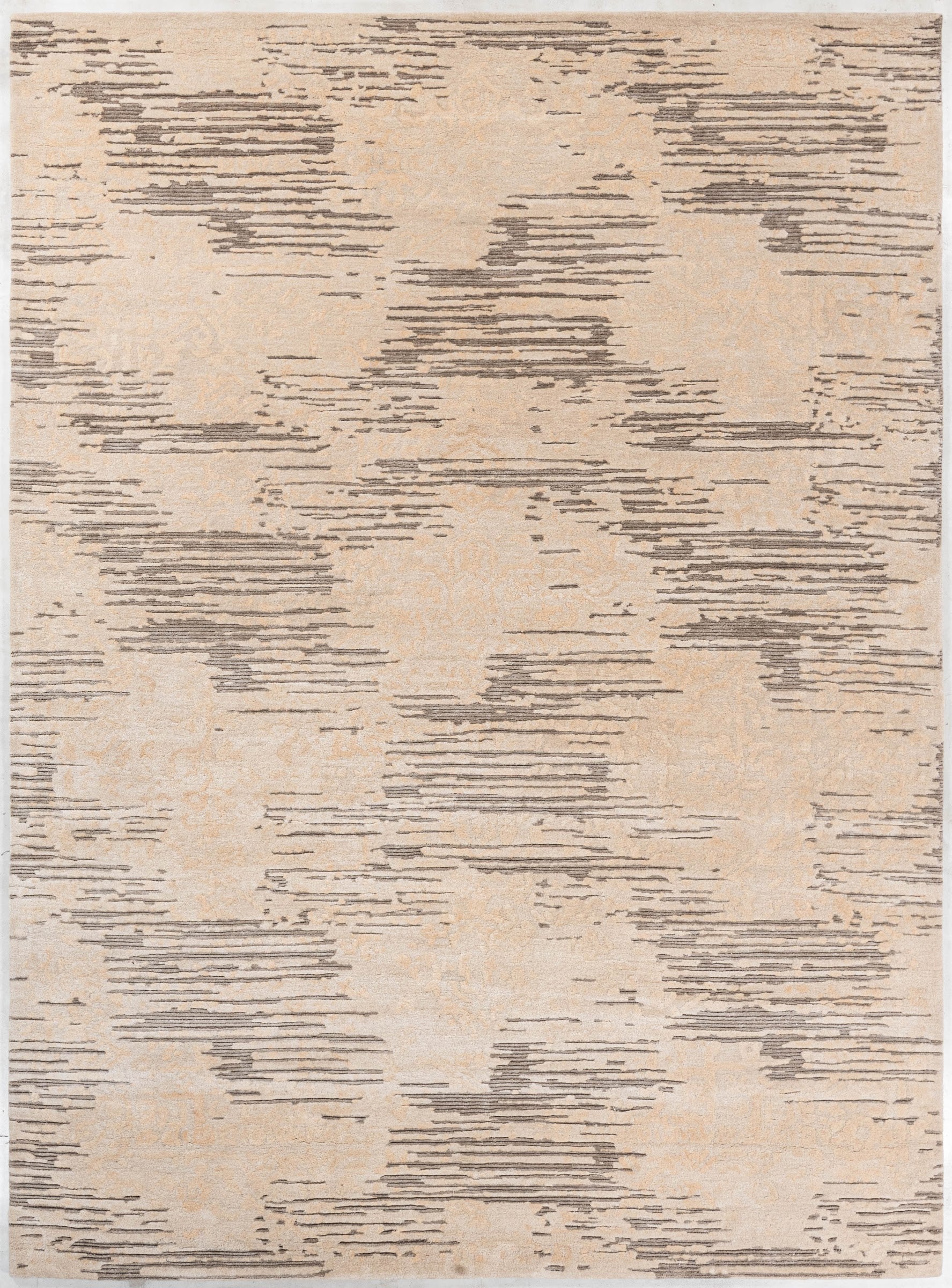 Ivory handmade wool and silk rug in ivory, beige and taupe